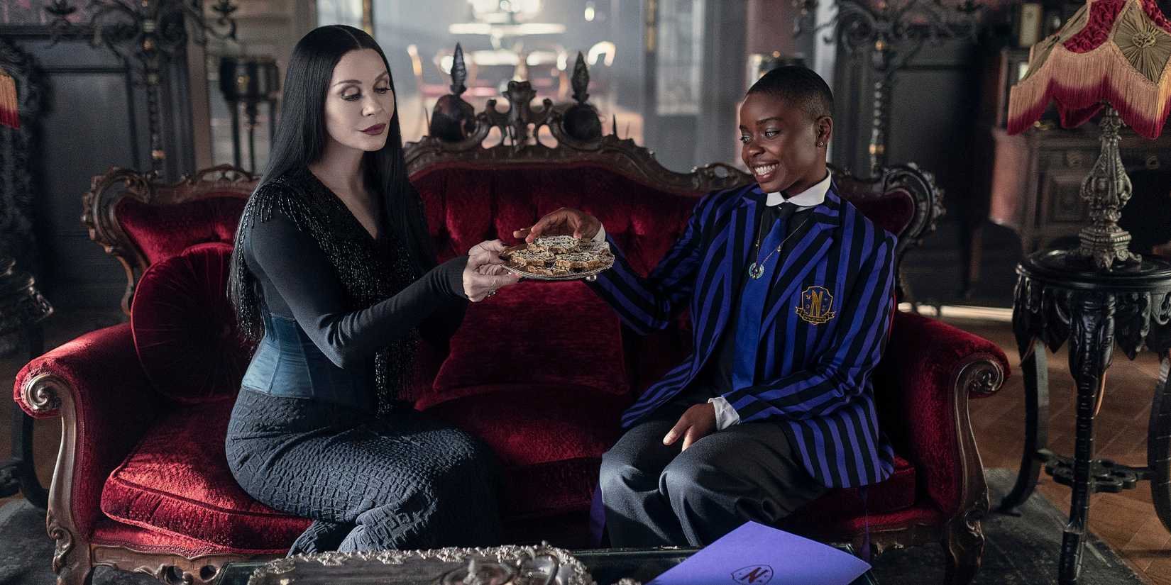 Bianca and Morticia sitting together in Wednesday season 2