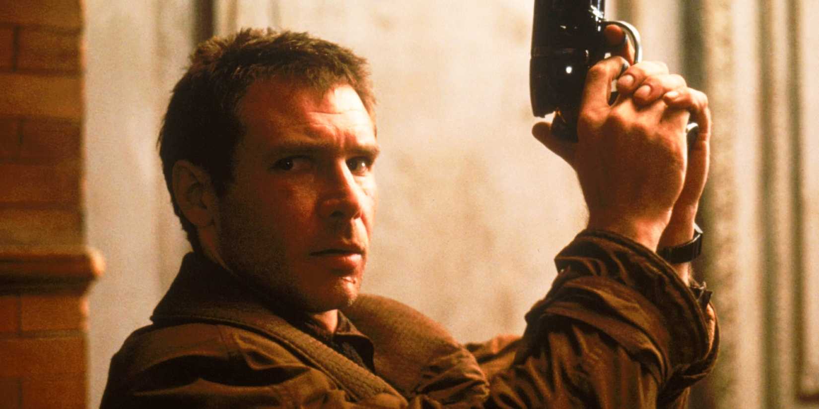 Deckard holds up his pistol while looking sideways in Blade Runner