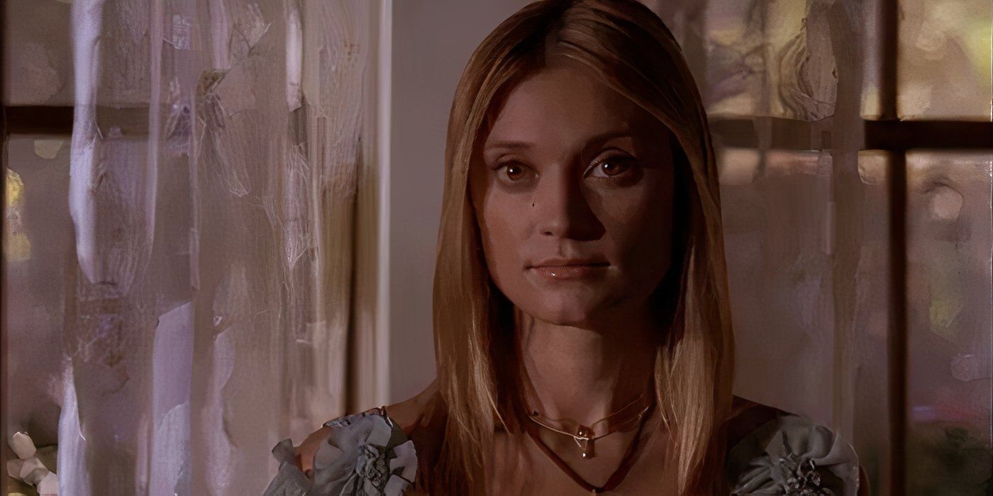 Casey Cartwright stands in front of the curtains inside the ZBZ house on Greek