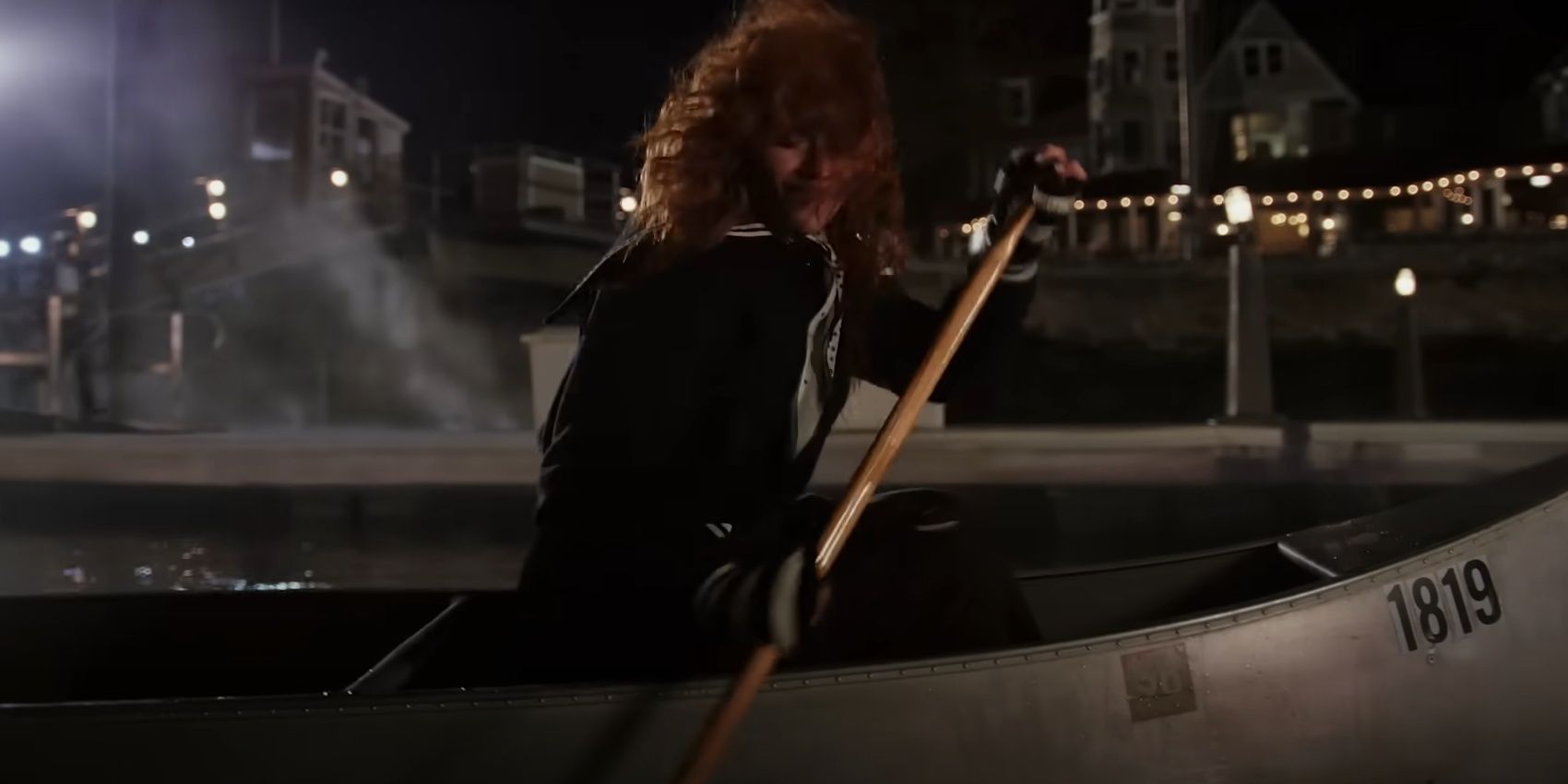 Charlie riding in a canoe in Poker Face