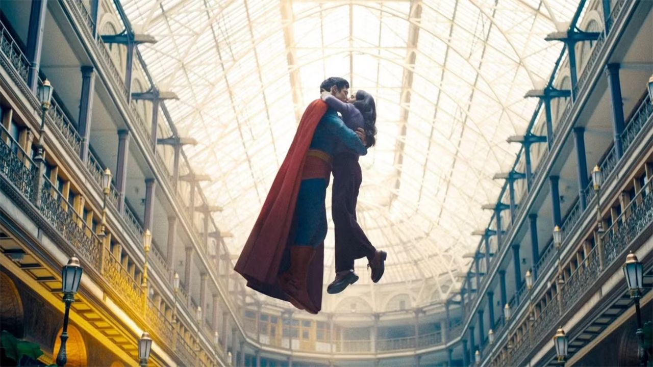 Clark in costume and Lois kissing in Superman