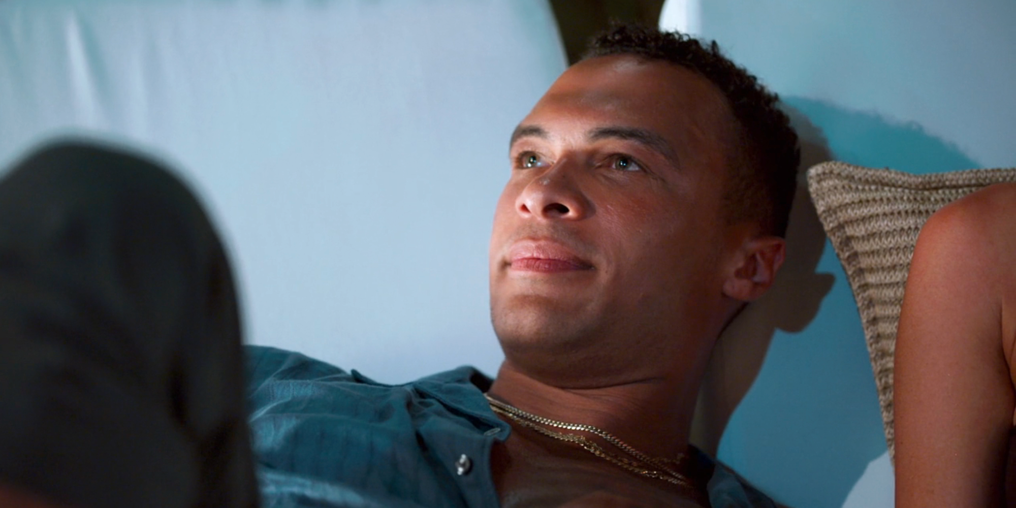 Dale Moss stares off into the distance while laying on a couch on Bachelor In Paradise season 10-1