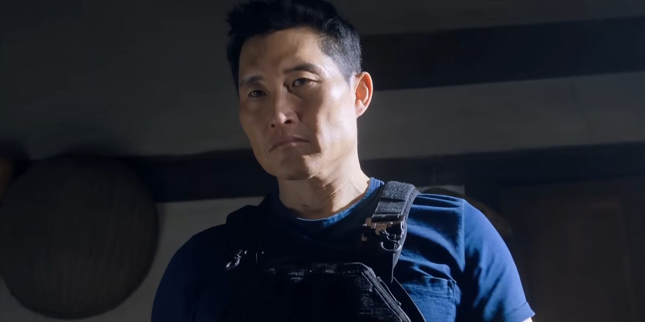 Daniel Dae Kim as David looking intensely while wearing a bulletproof vest in Butterfly