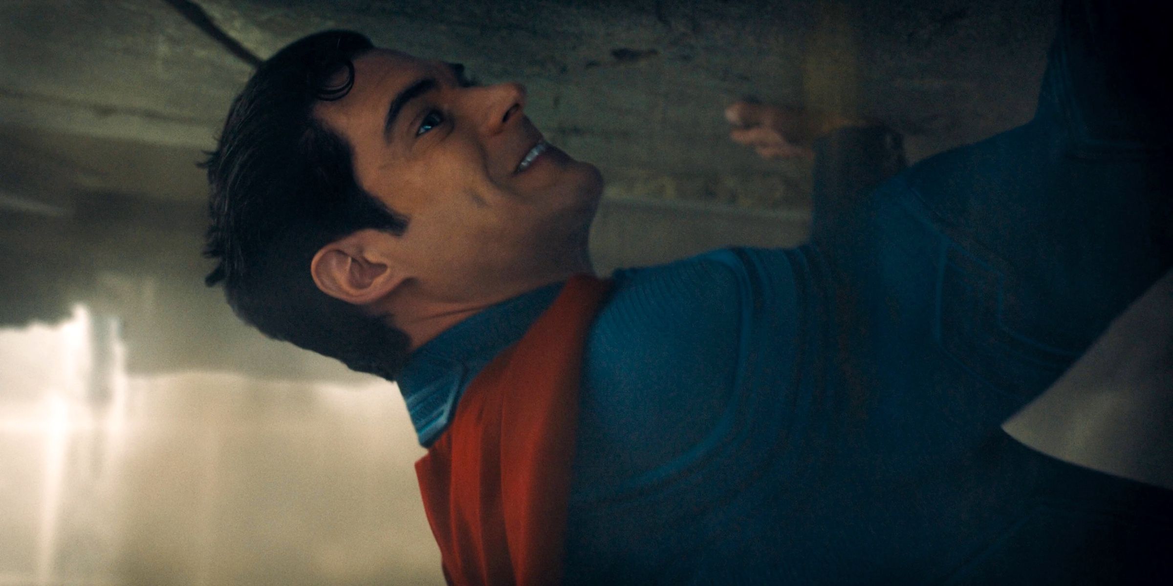 David Corenswet As Superman Holding Up A Building