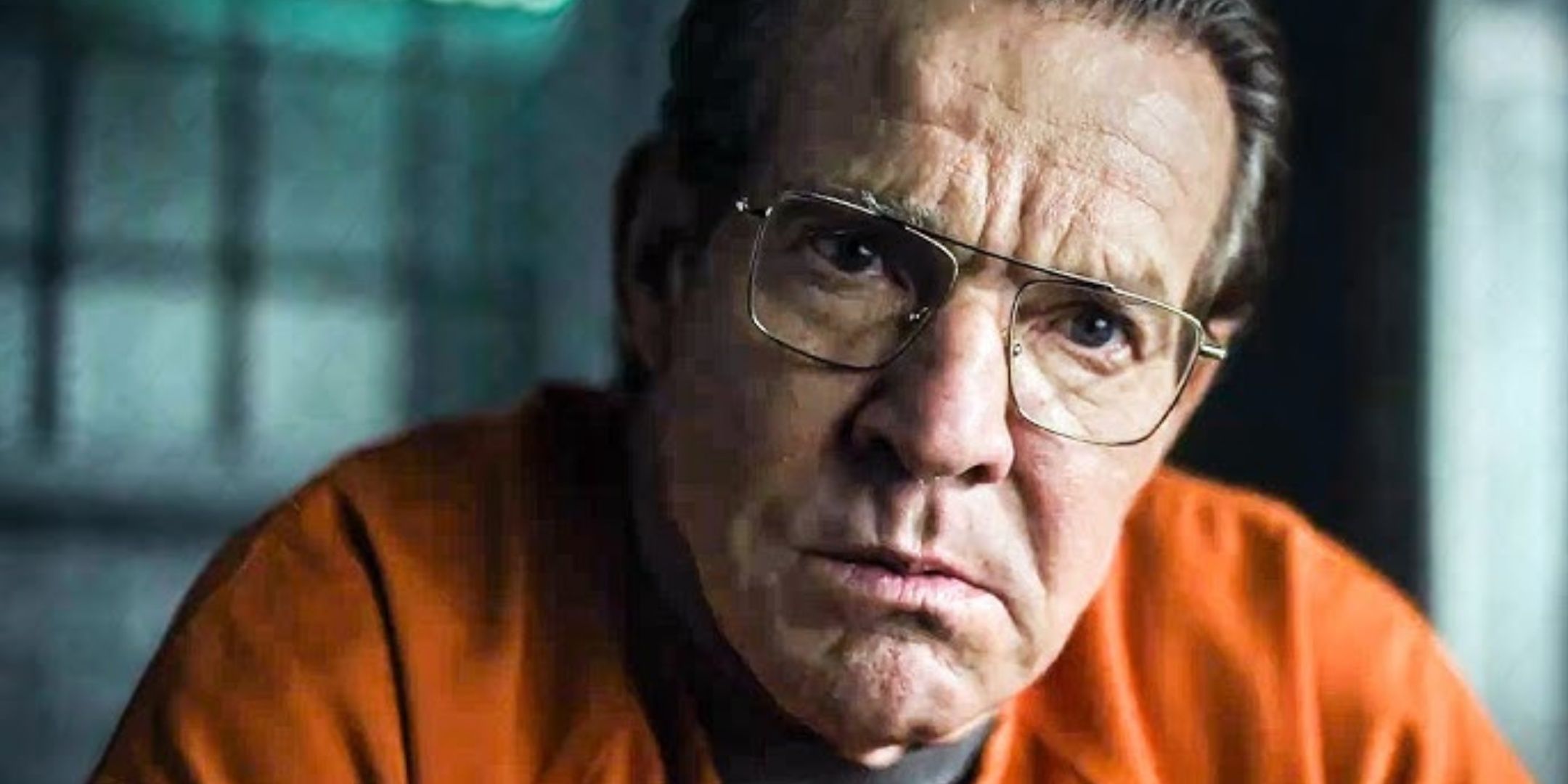 Dennis Quaid looking intense in a prison uniform in Happy Face