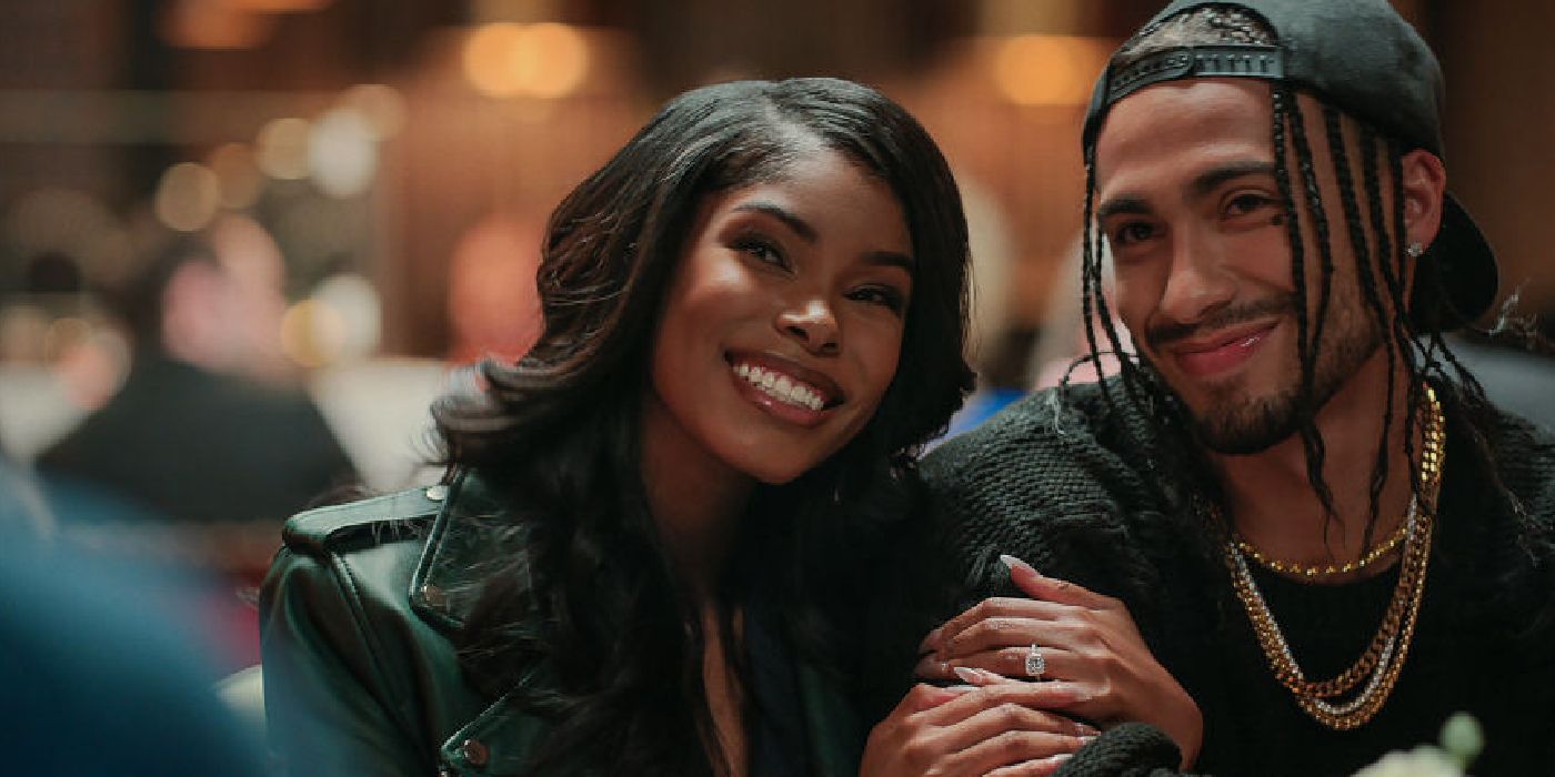 Diamond White holds Z as Tiffany while smiling in Madea's Destination Wedding