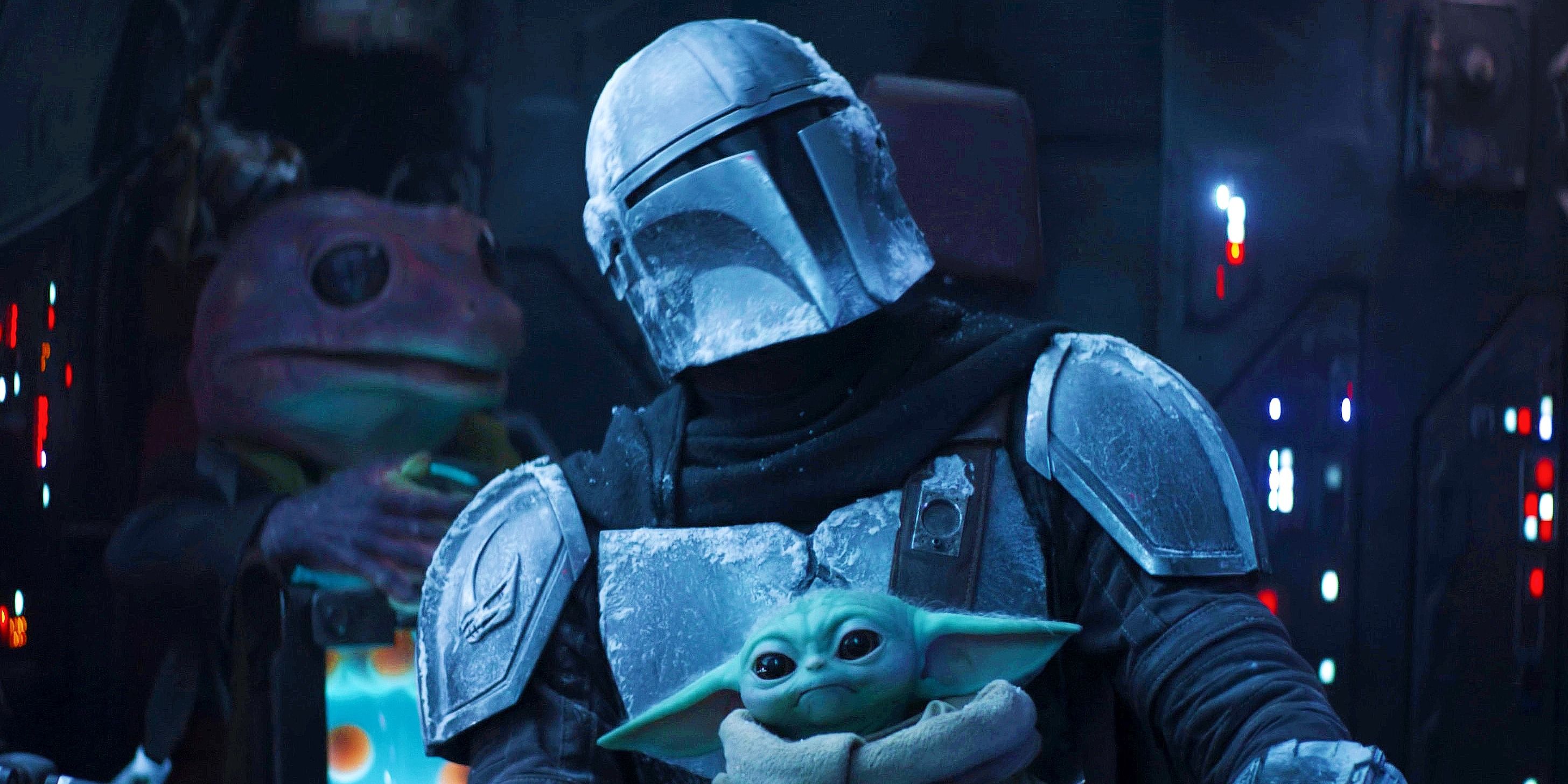 Din Djarin with Grogu in his lap in The Mandalorian season 2