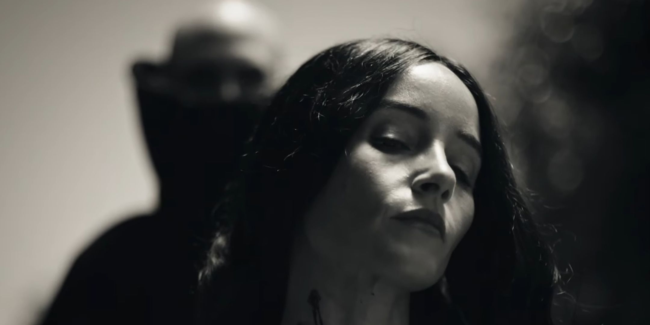 Dracula looming over Mina with bite marks in her neck in Abraham's Boys: A Dracula Story