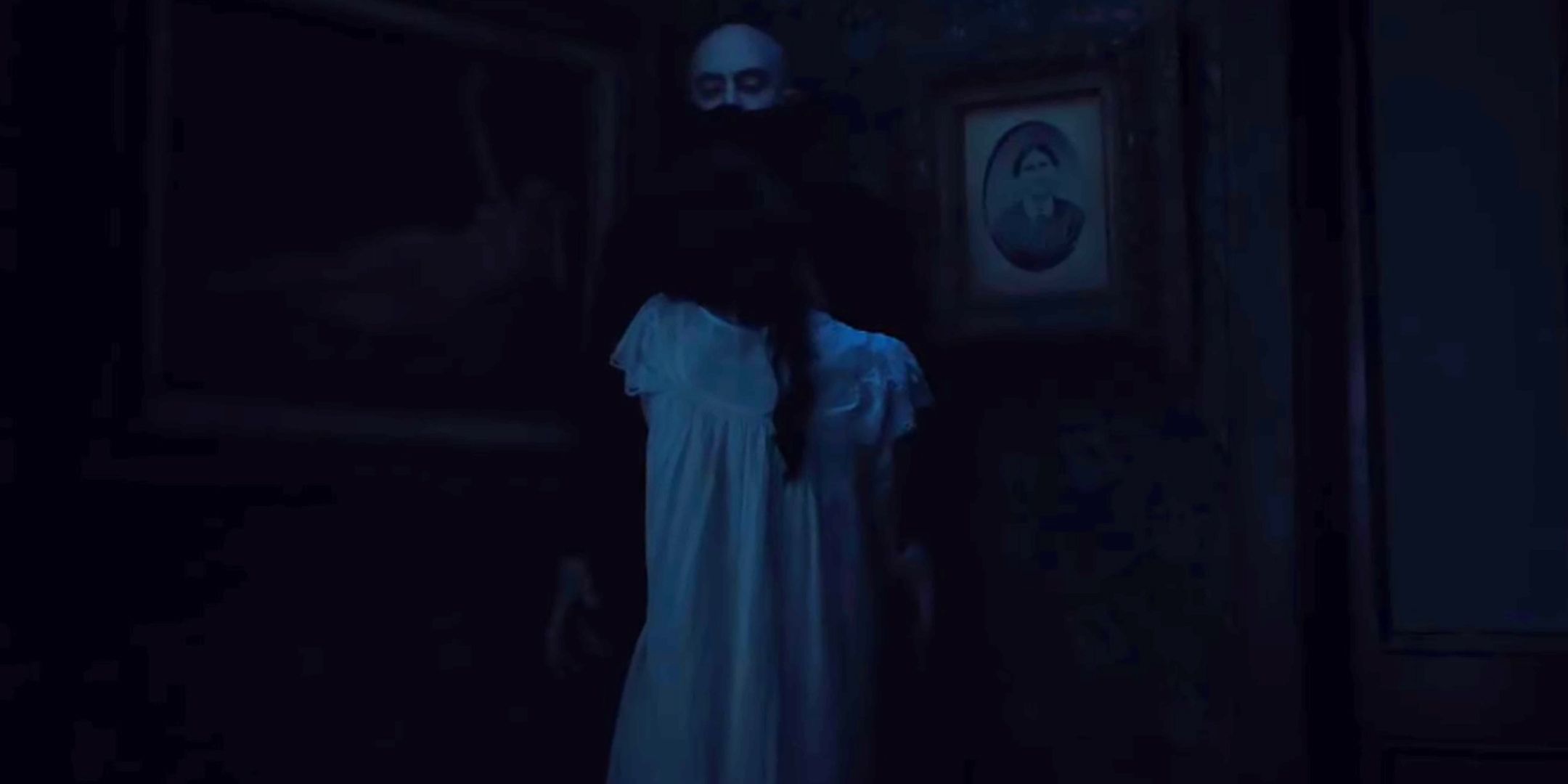 Dracula standing in a dark corner with Mina in front of him in Abraham's Boys: A Dracula Story
