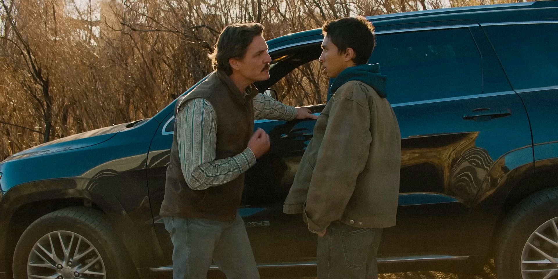 Ted Garcia (Pedro Pascal) scolding Eric Garcia (Matt Gomez Hidaka) in Eddington