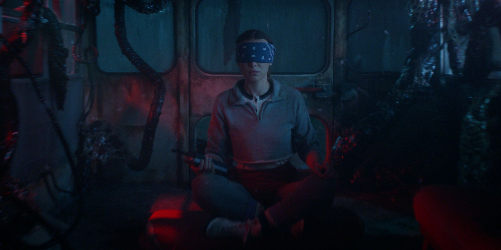 Eleven wearing a blindfold in a bus in the Upside Down in Stranger Things season 5