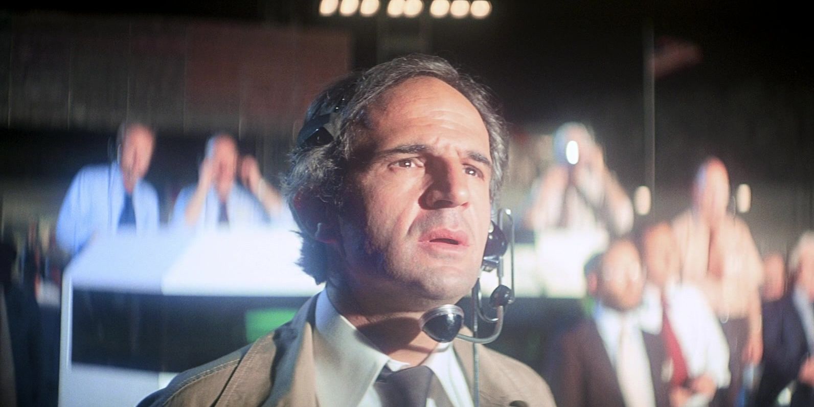 Francois Truffaut looking at something brightly lit in awe in Close Encounters of the Third Kind