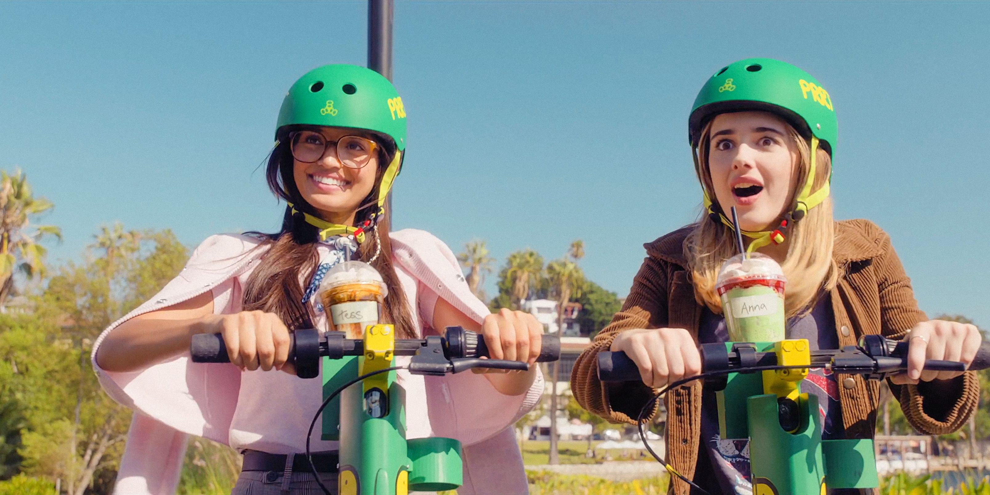 Lily Davies (Sophia Hammons) and Harper Coleman (Julia ʙuттers) riding scooters in Freakier Friday (2025)