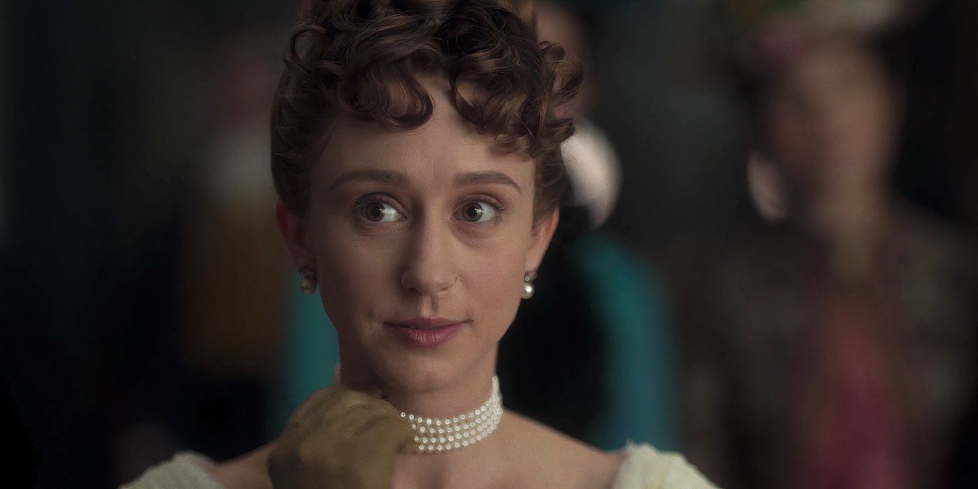 Gladys touching her Pearl Necklace
