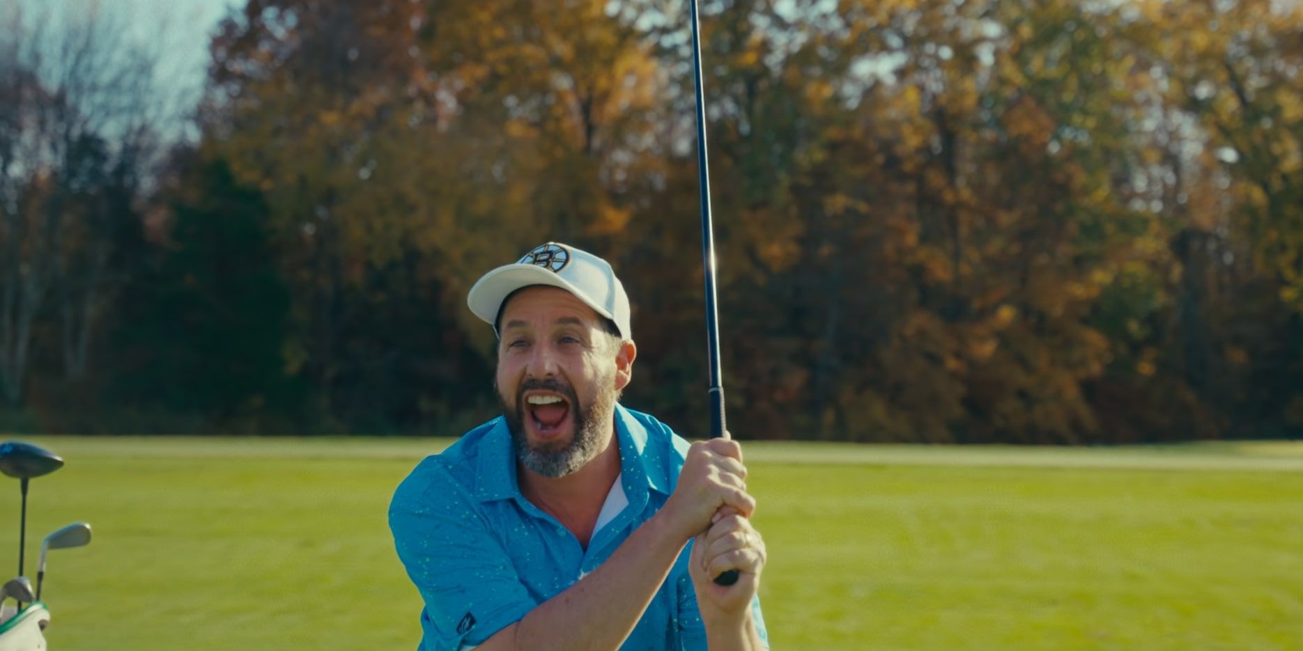 Happy looking excited with a golf club in Happy Gilmore 2