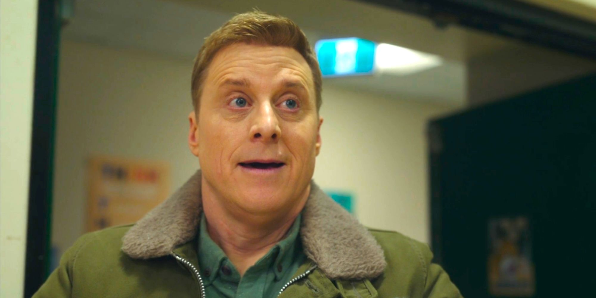 Harry looking surprised while walking into the gymnasium in Resident Alien season 4 episode 6