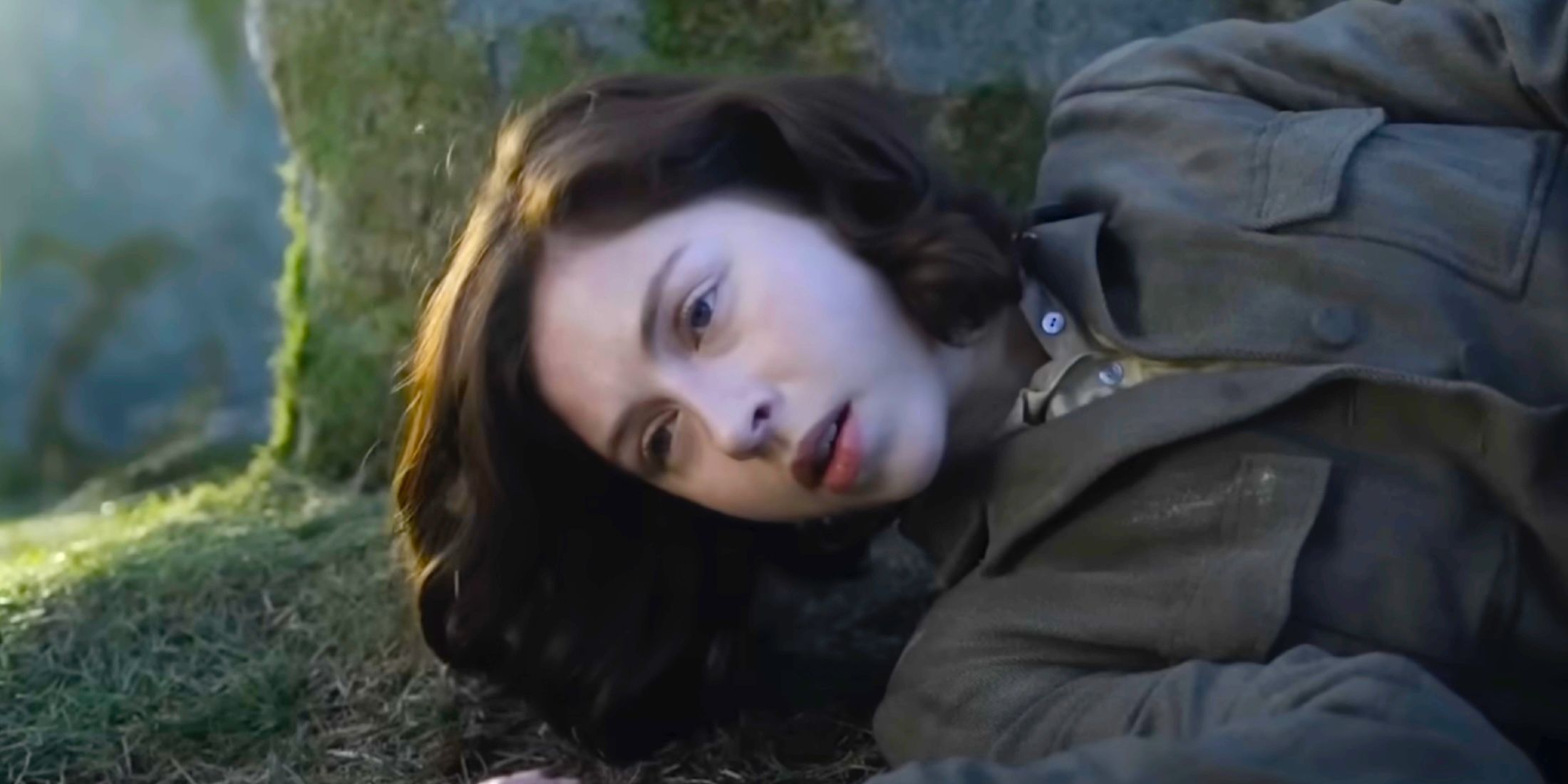 Hermione Corfield as Julia Moriston laying on her side in Outlander Blood of My Blood