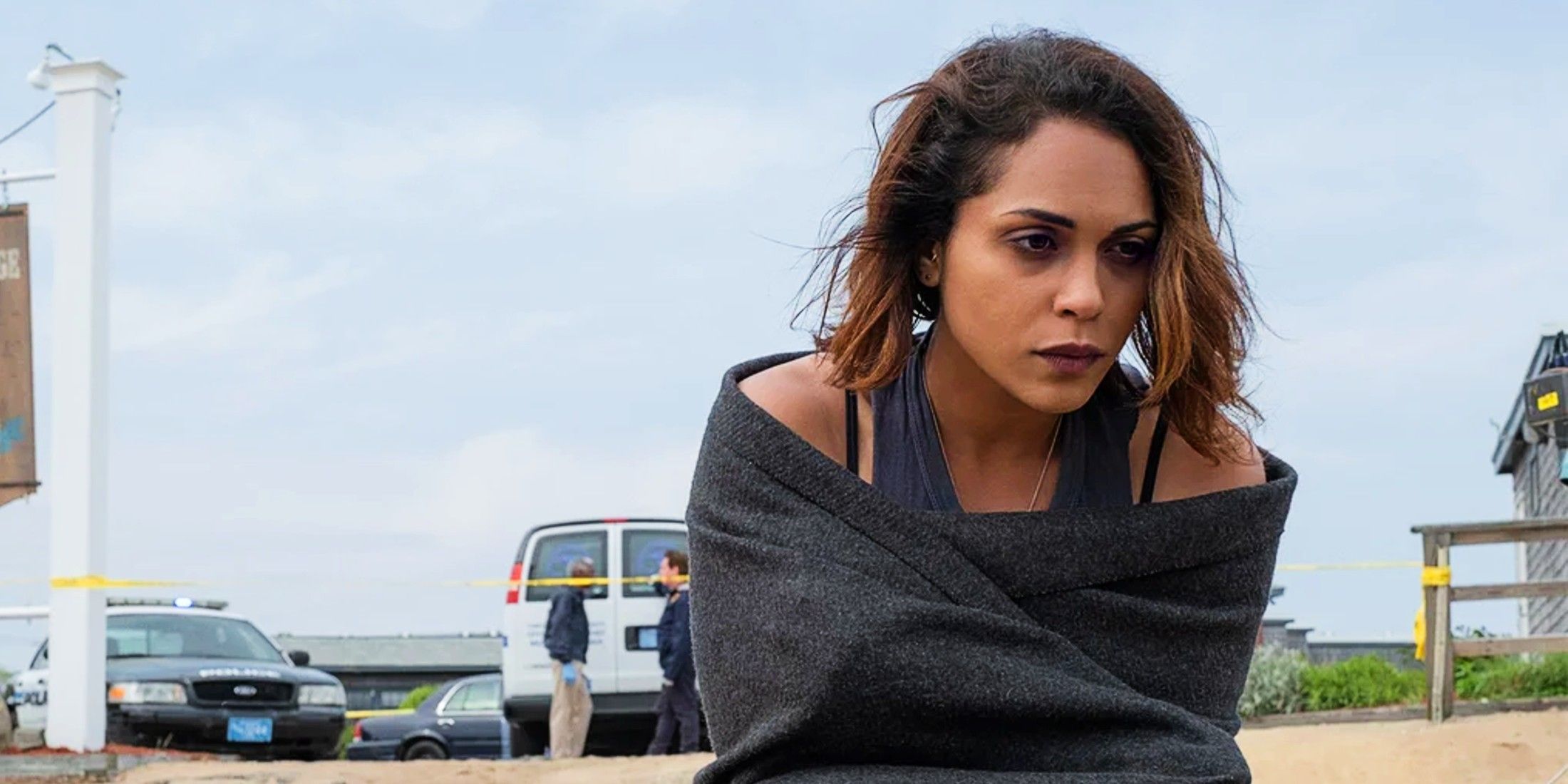 Monica Raymund looking upset and wrapped in a towel in Hightown