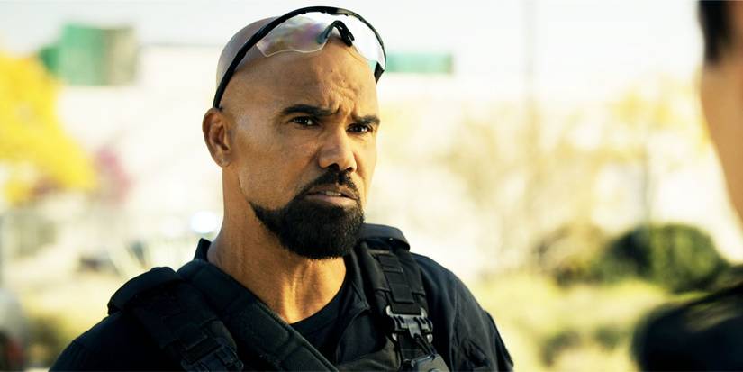 Hondo looking at Victor, mid-conversation, in SWAT season 7