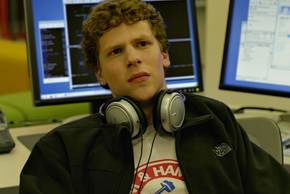 Jesse Eisenberg as Mark Zuckerberg leaning back and looking upset in The Social Network
