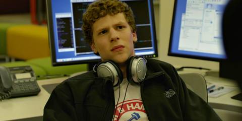 Jesse Eisenberg as Mark Zuckerberg leaning back and looking upset in The Social Network