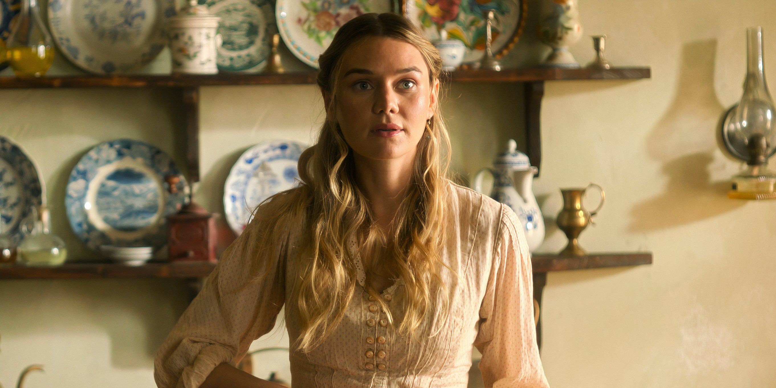 Jinny stands in the kitchen in The Buccaneers season 2 episode 4