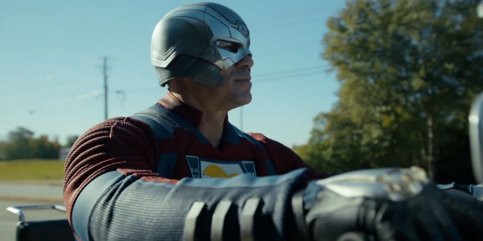 John Cena driving on his motorcycle in the Peacemaker season 2 trailer