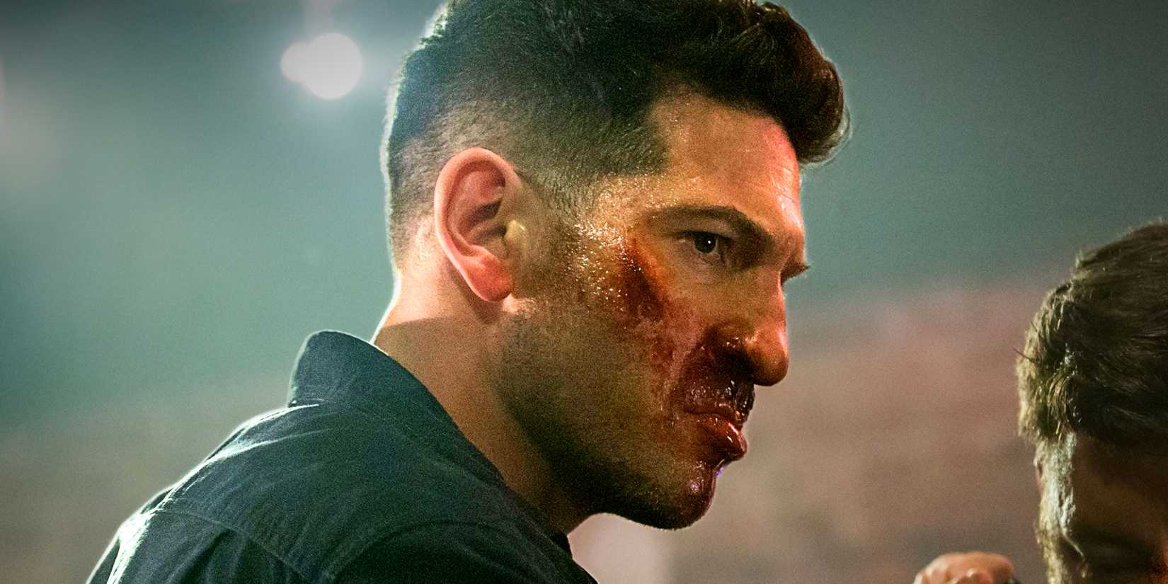 Jon Bernthal's Frank Castle fights with a bloodied face in Netflix's The Punisher