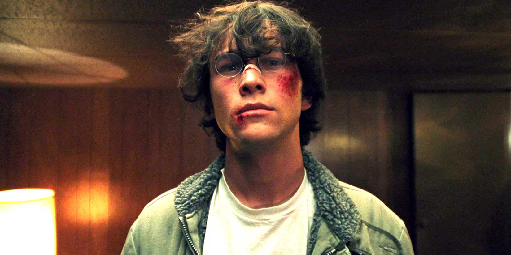 Joseph Gordon-Levitt as Brennan looking intense with his face beaten up in The Pin's basement in Brick
