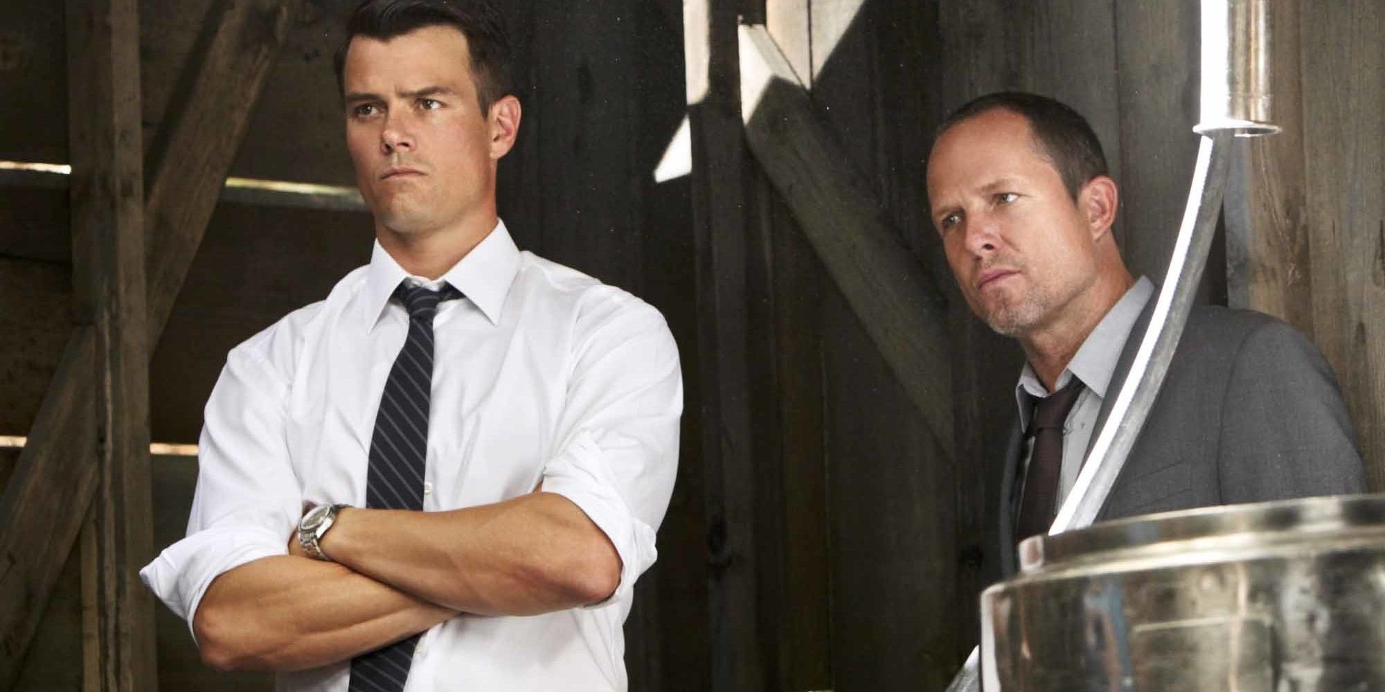 Josh Duhamel with arms crossed standing next to Dean Winters in Battle Creek