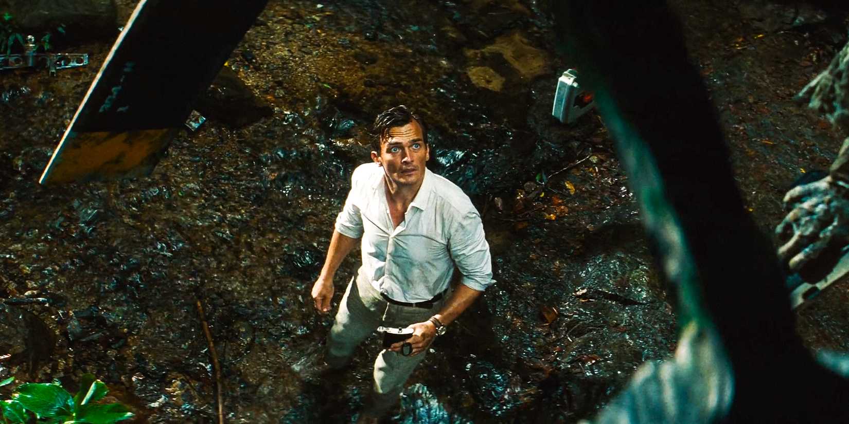 Martin Krebs (Rupert Friend) staring upward, confused in Jurassic World Rebirth