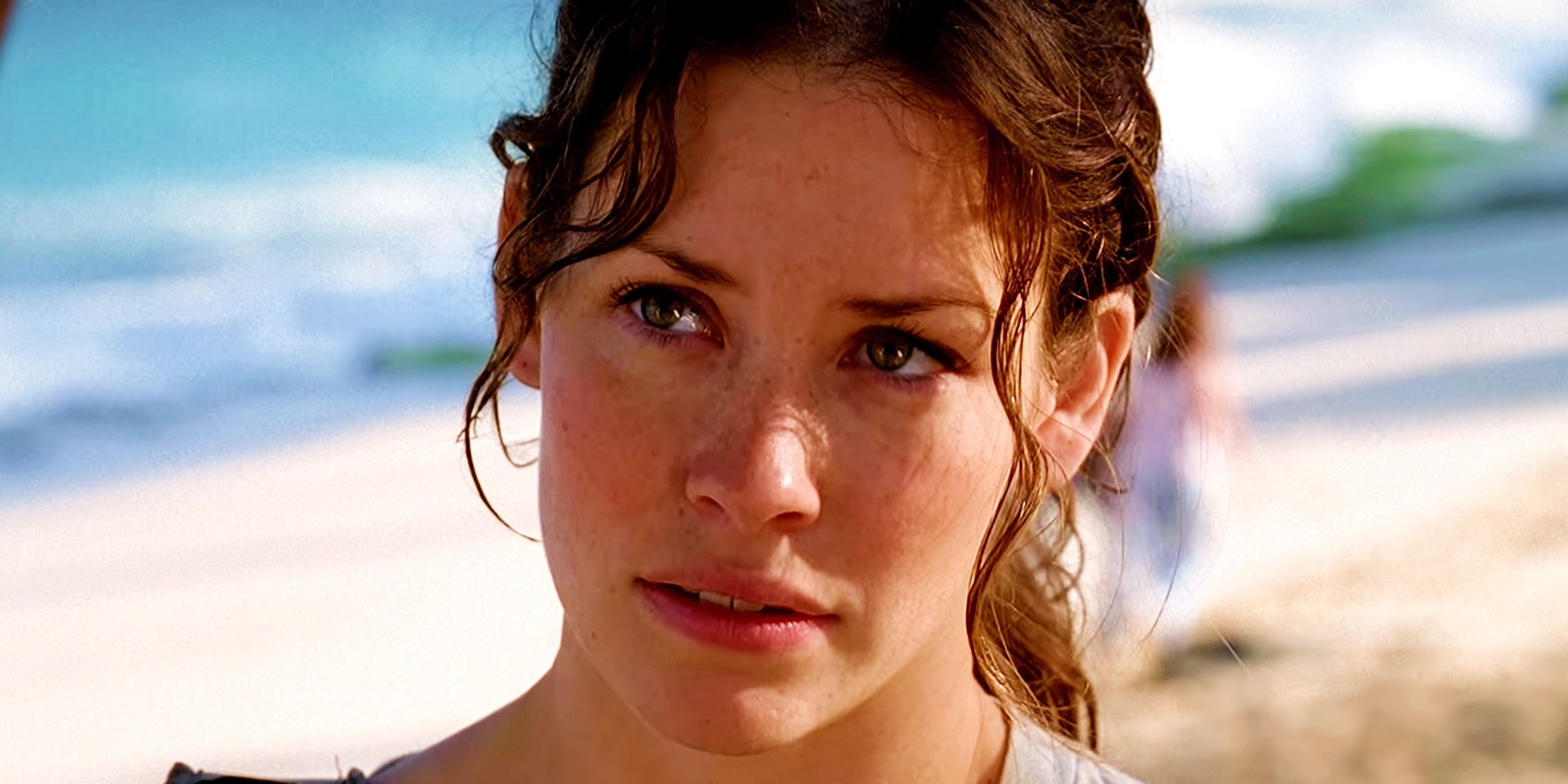 Kate looking up in Lost with a serious expression on her face