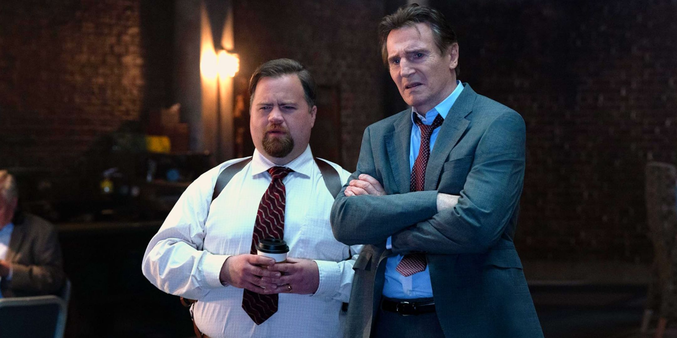 Liam Neeson as Frank Drebin Jr and Paul Walter Hauser as Captain Ed Hocken Jr in 2025's Naked Gun