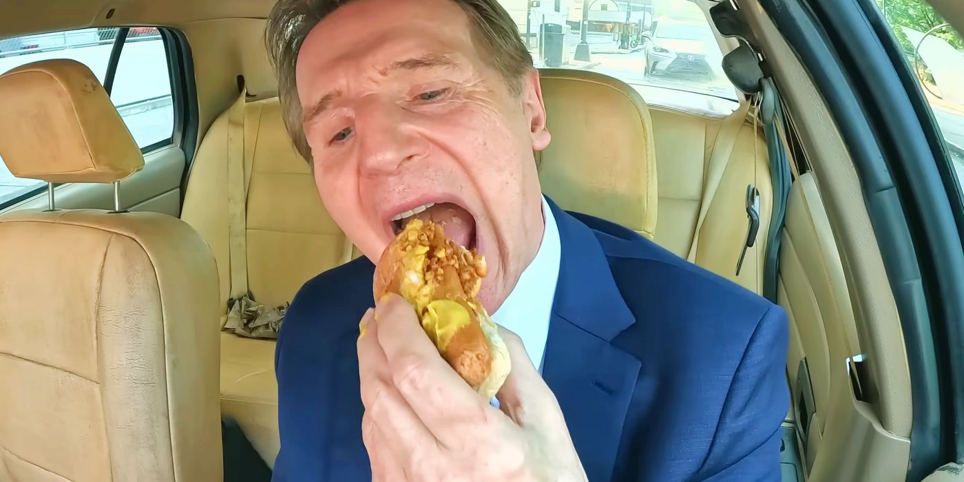 Liam Neeson eating a H๏τ dog while driving his squad car in The Naked Gun 2025