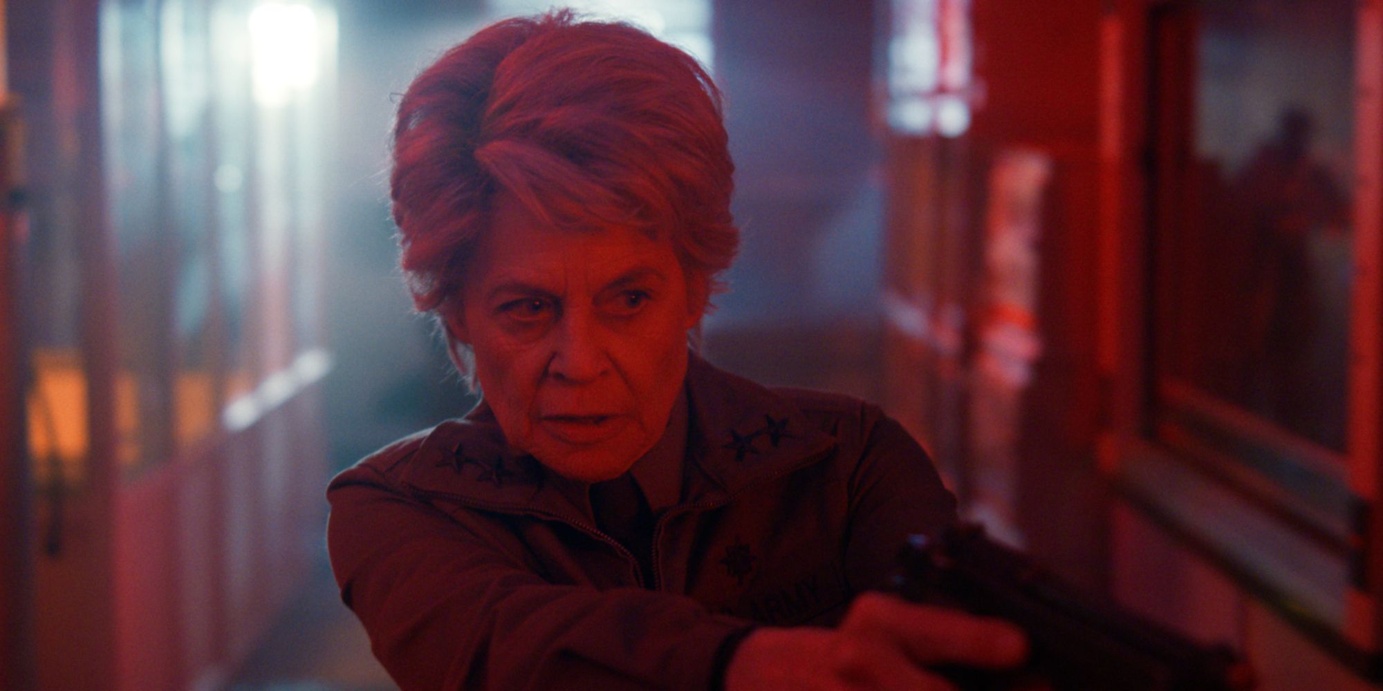 Linda Hamilton aiming a gun in Stranger Things season 5