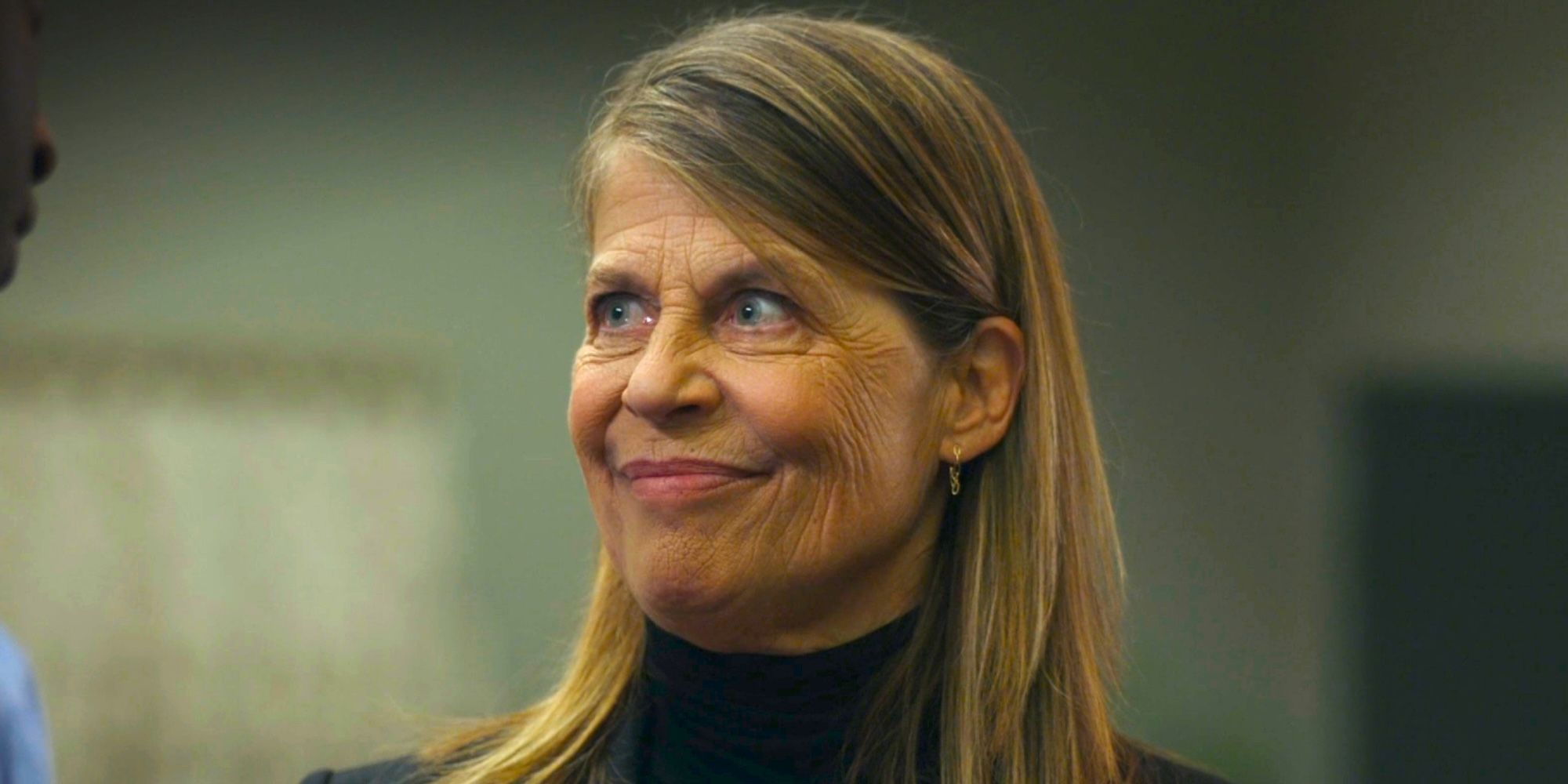 Linda Hamilton as General McCallister smiling mockingly in Resident Alien season 3 episode 5