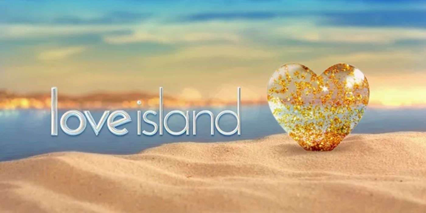 Love Island UK LOGO with gold heart in sandy beach