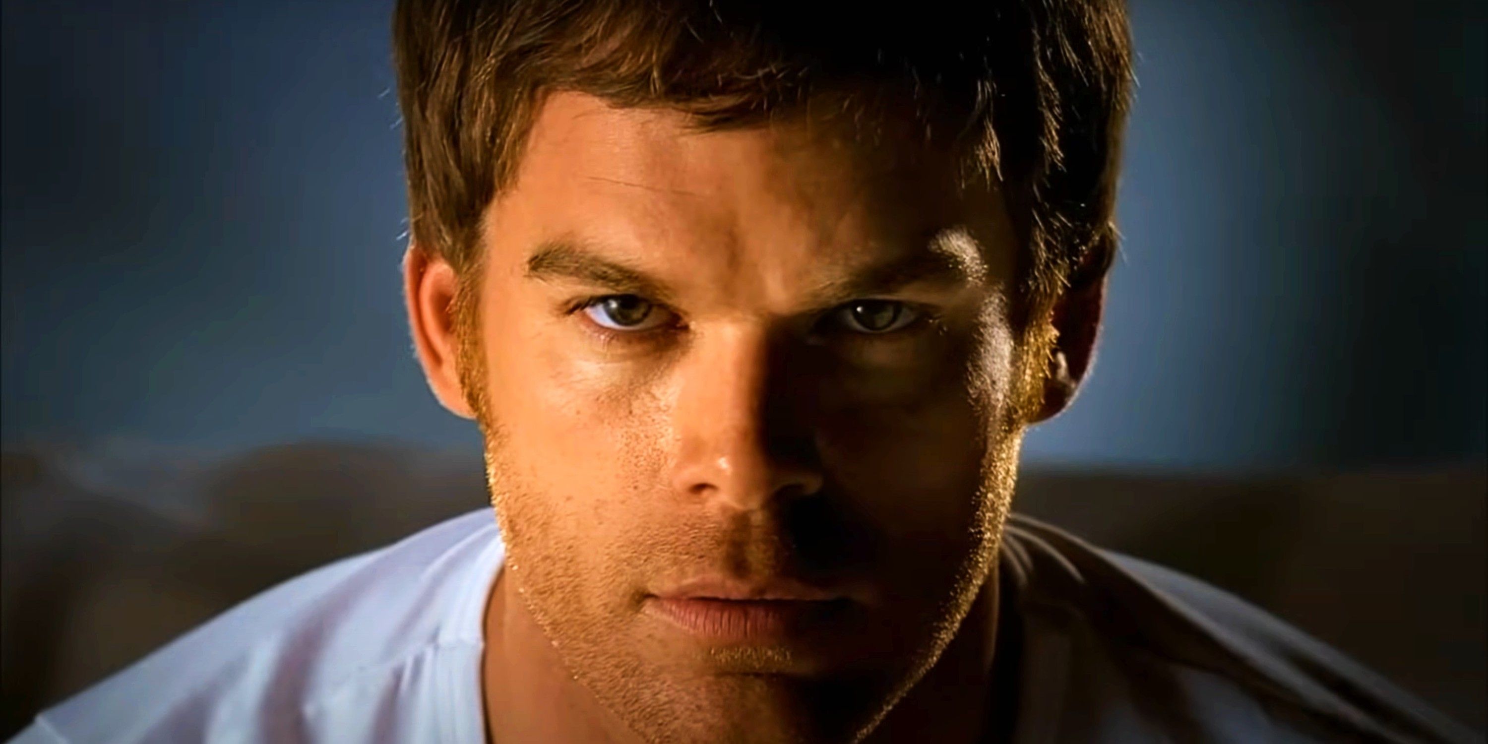 Michael C. Hall as Dexter Morgan staring into the camera in Dexter's opening credits intro