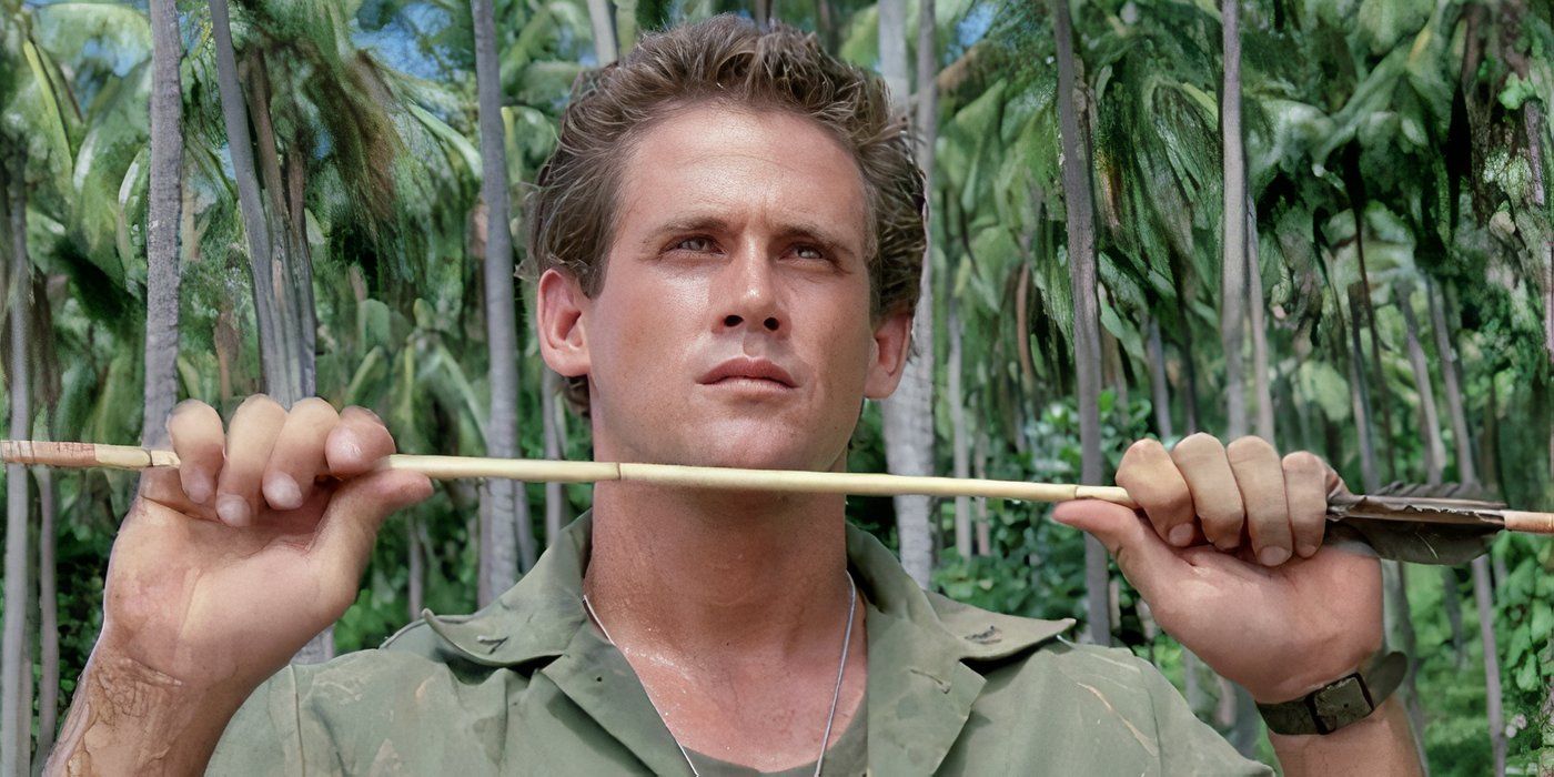 Michael Dudikoff holds a stick in American Ninja