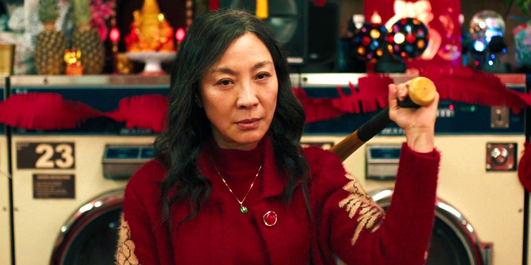 Michelle Yeoh holding a bat in Everything Everywhere All At Once