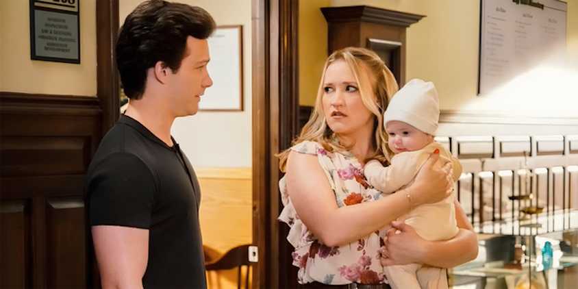 Montana Jordan's Georgie looks at Emily Osment's worried Mandy as she holds their baby CeeCee in Young Sheldon