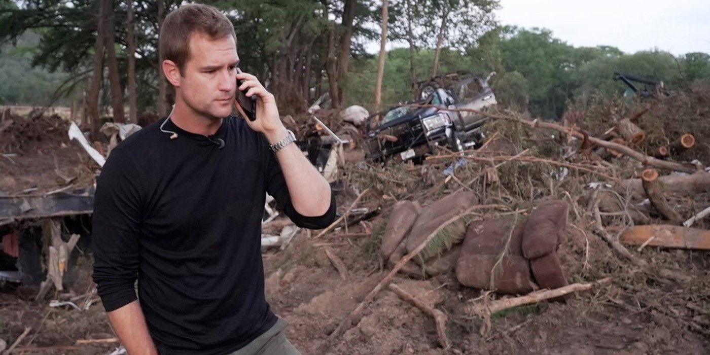 Morgan-Chesky-On-Phone-In-Front-Of-Wreckage-In-Kerrville-Texas