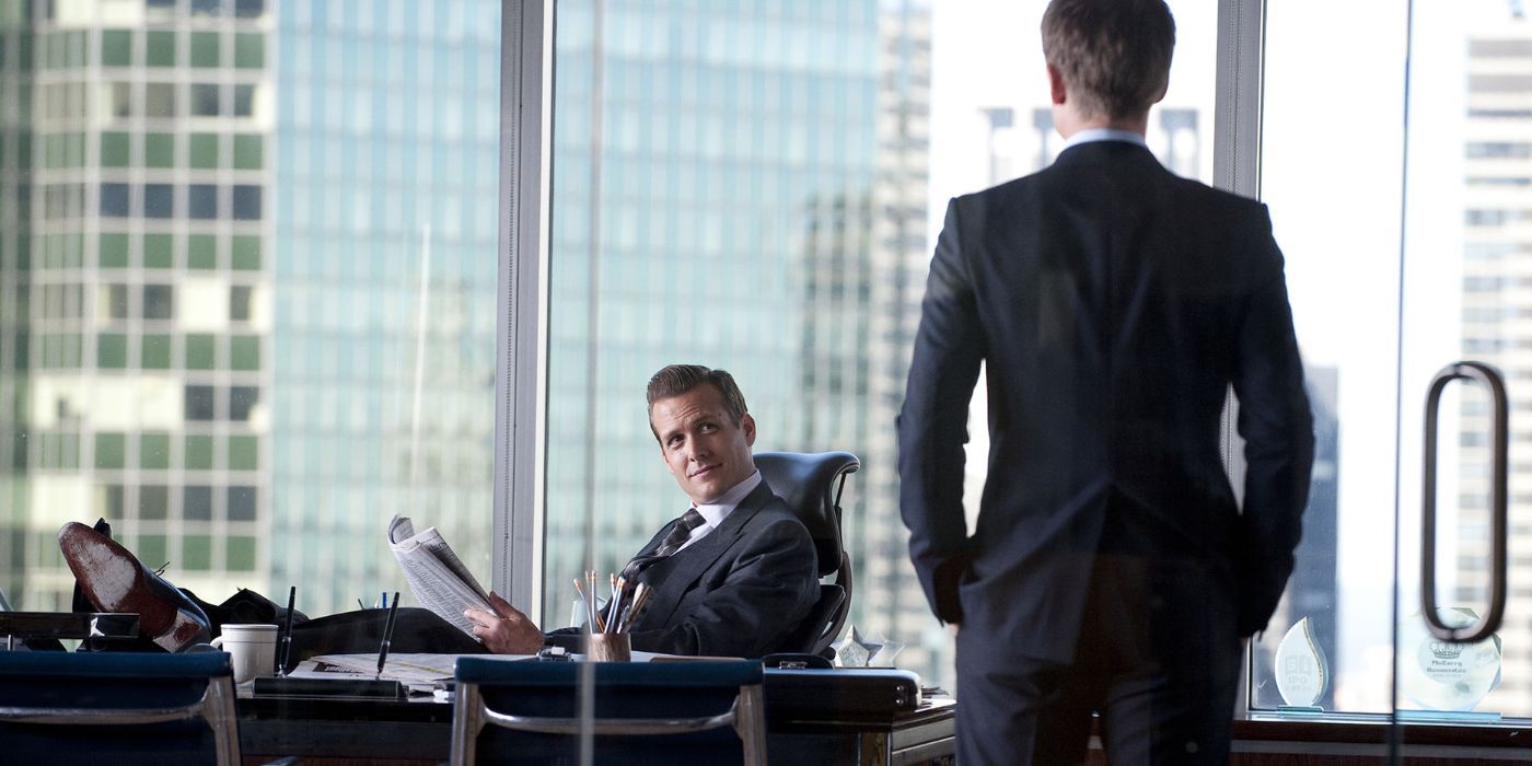 Harvey sitting in his office while Mike talks to him