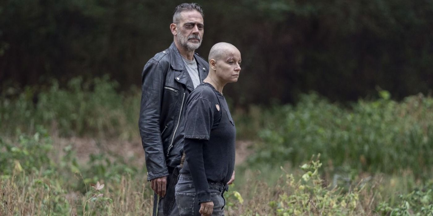 Negan and Alpha standing in a field in The Walking Dead Walk With Us