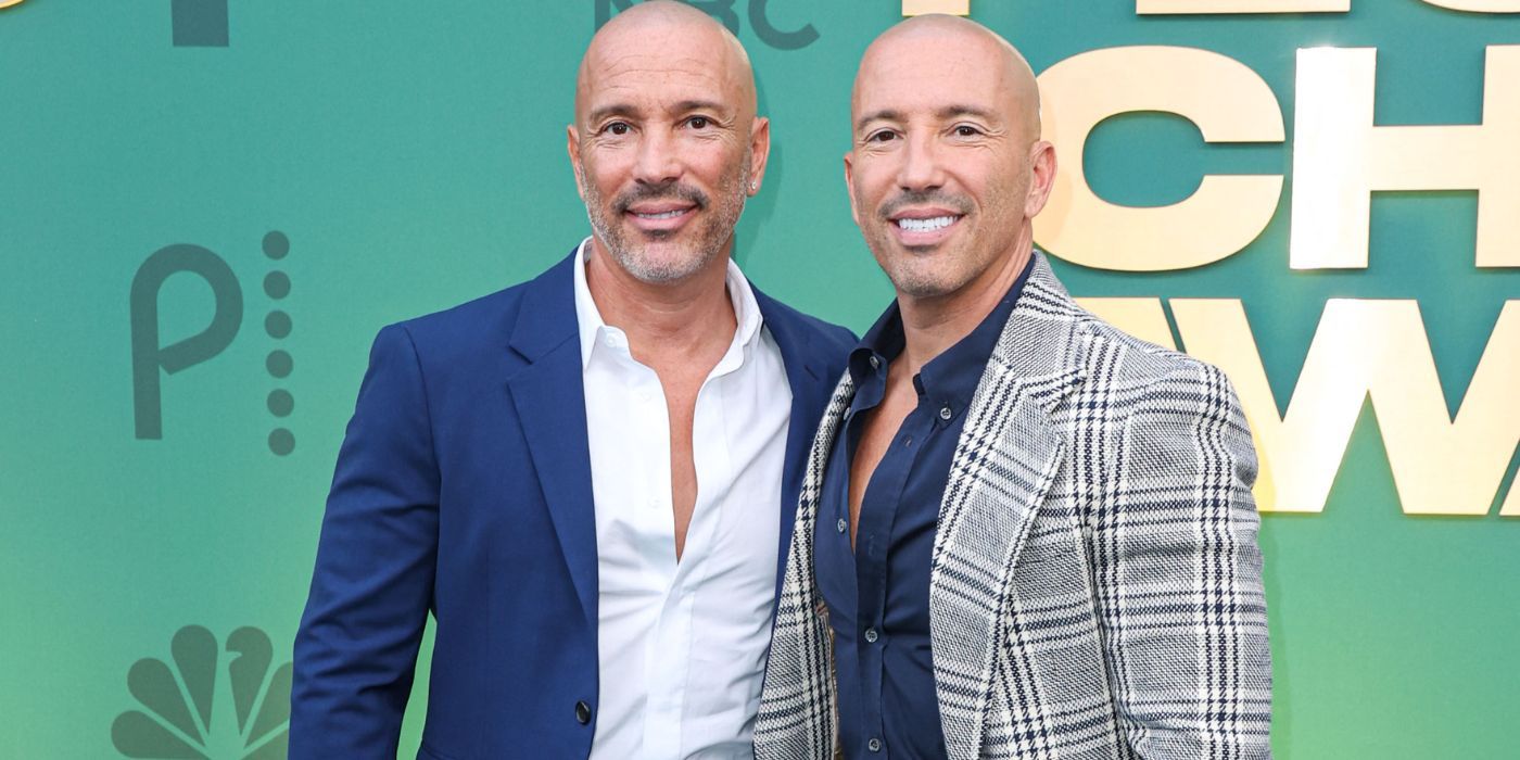 Selling Sunset's Brett and Jason Oppenheim standing beside each other on a red carpet