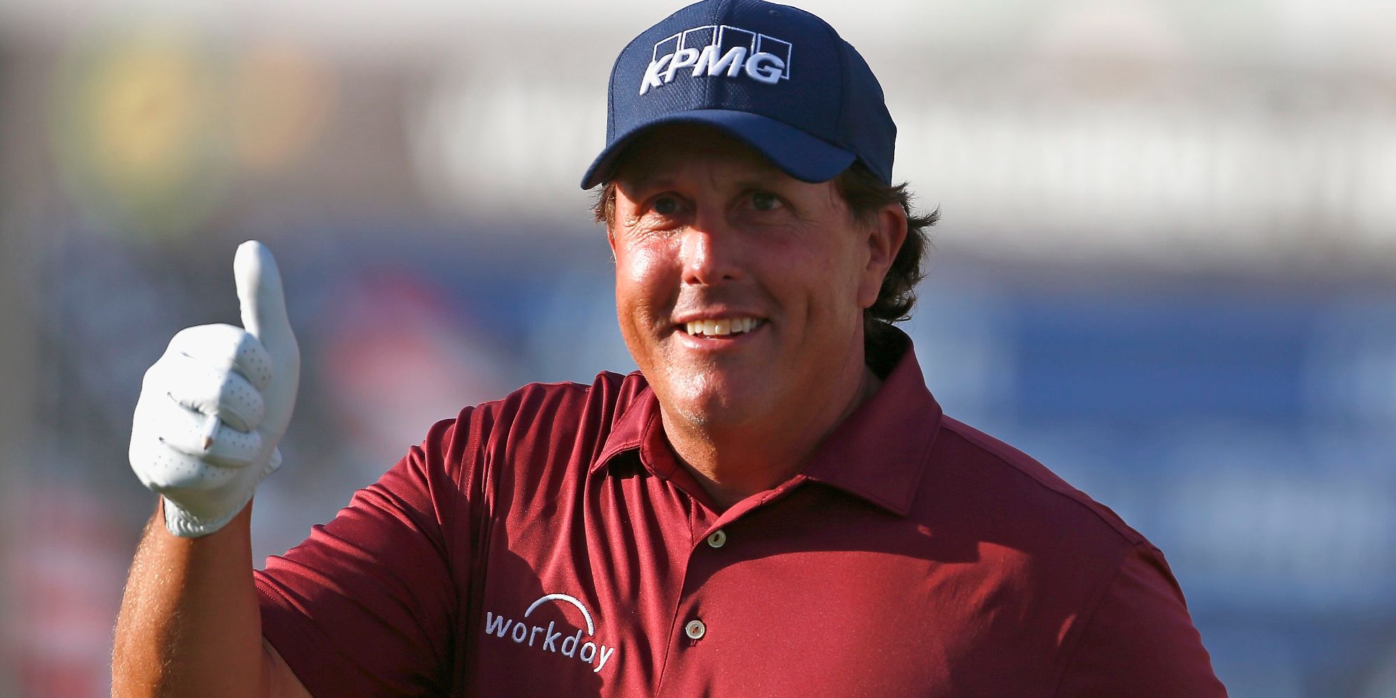 Phil Mickelson giving a thumbs up on a golf tour