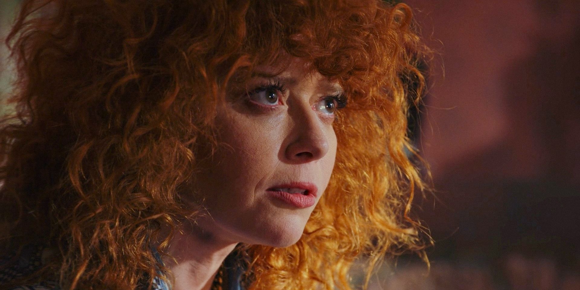 Natasha Lyonne's Charlie looking intensely at The Iguana in Poker Face season 2 episode 12
