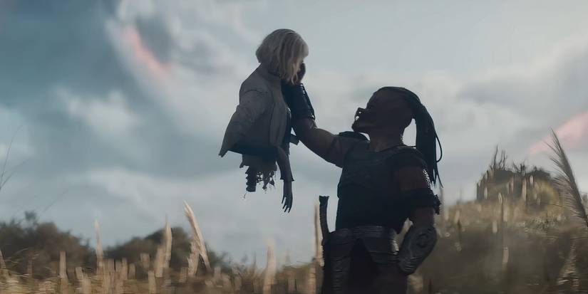 Dek holding up Thia's severed torso in Predator: Badlands