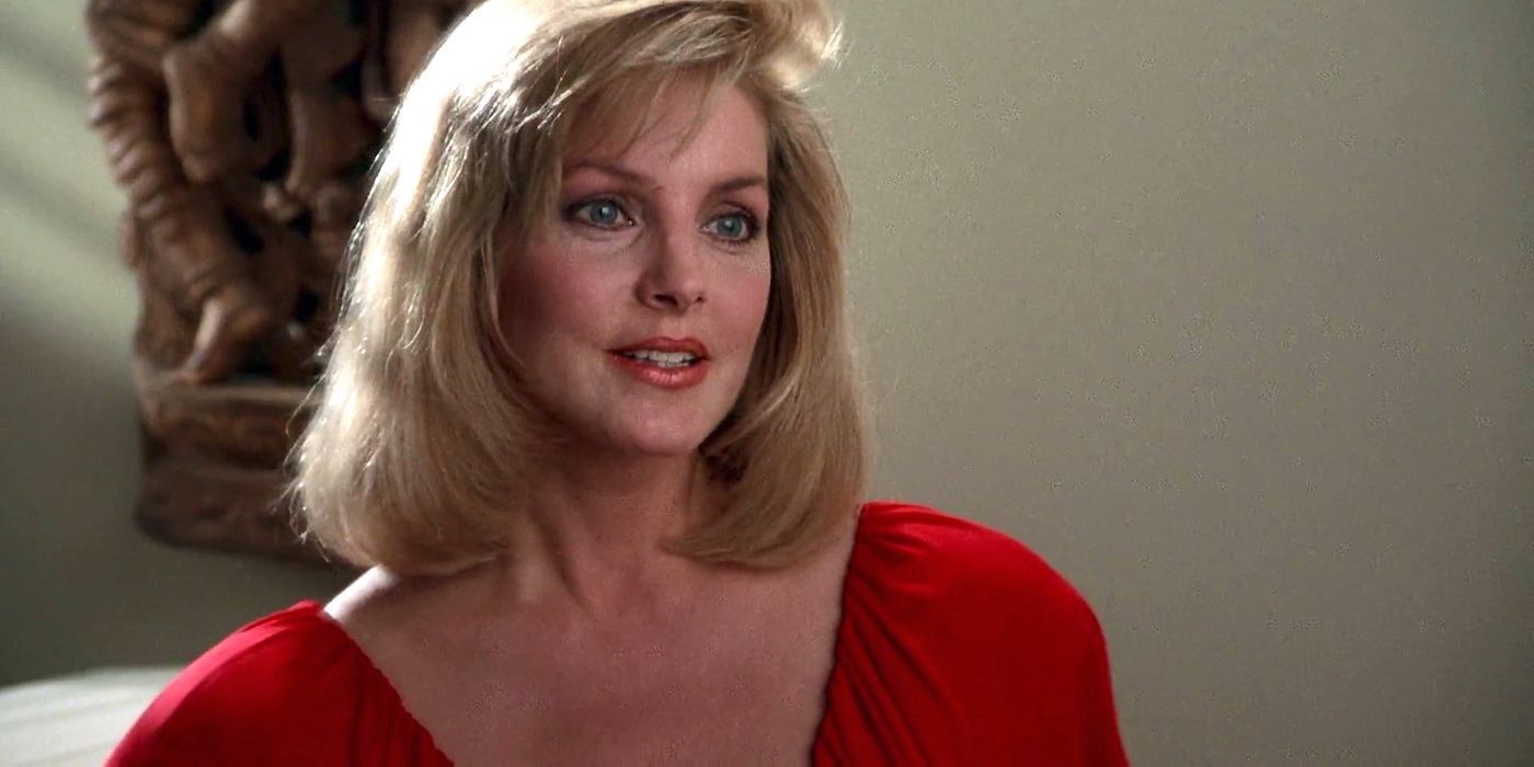Priscilla Presley as Jane looking at someone off camera in a Naked Gun movie