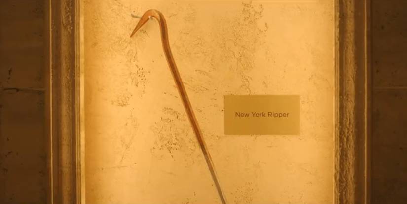 A long hooked tool with a placard that reads "New York Ripper" in Leon Prater's museum in Dexter: Resurrection season 1, episode 4